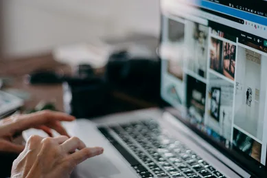 Close-up of a laptop displaying a structured website layout with organized content sections, representing conversion-focused web design and strategic page structure for service-based businesses.